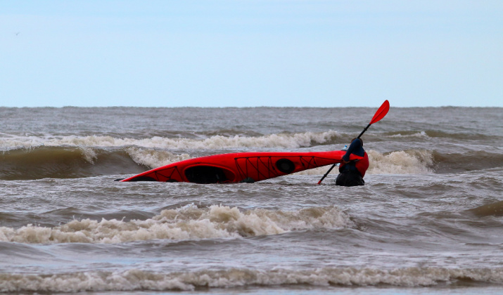 Turn Over the Kayak to Empty It